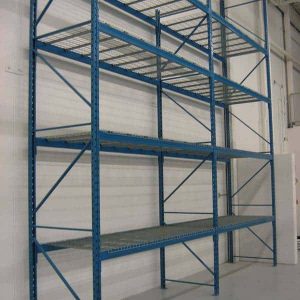 Used pallet racking in a warehouse setting.