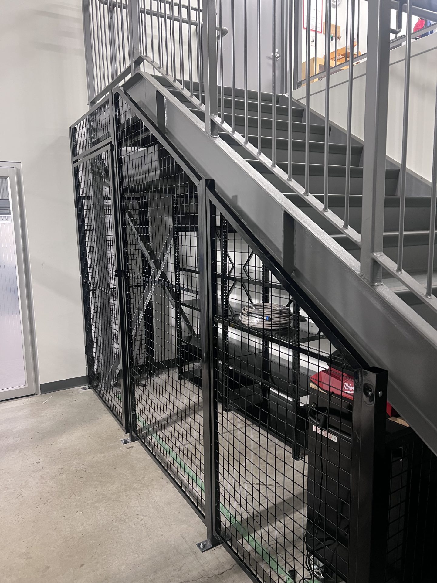 Black security fencing under staircase