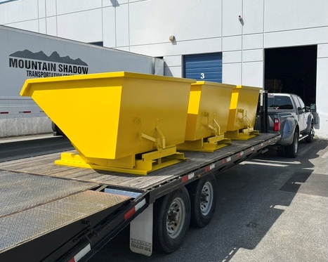 yellow self-dumping hoppers