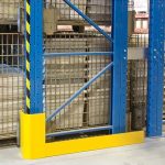 Blue pallet racking covered by a yellow steel protector on the bottom and wrapped around one of the poles.