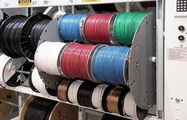 Wire stored in a wire carousel in a warehouse setting.