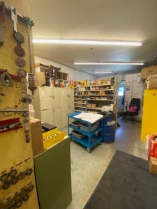 Before photo showing disorganized marine terminal tool storage with limited accessibility