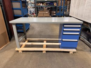 Grey workbench with blue drawers